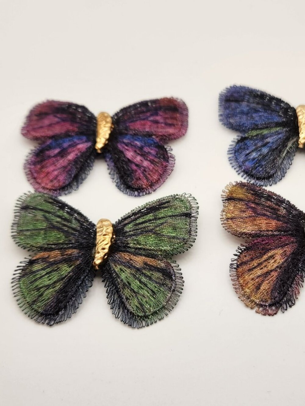 Beautiful set of four butterfly brooches lightweight fabric gold tone NIP